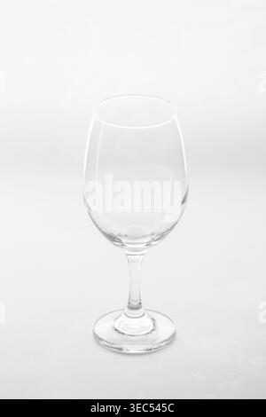 An empty wine glass, isolated against a white background Stock Photo