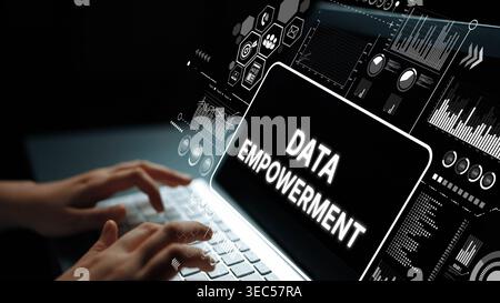 Hands typing on laptop with glowing screen displaying data empowerment, charts and graphics in a digital workspace concept. Asymptotic smart data Stock Photo