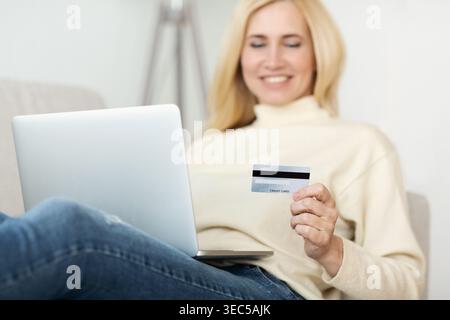 Middle-Aged Woman Using Credit Card For Paying Stock Photo
