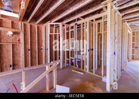 Workers build wooden beams frame walls at construction site where house is taking shape new home Stock Photo