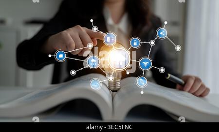 A conceptual image illustrating the blend of technology and knowledge, featuring a light bulb over an open book, representing innovative ideas and Stock Photo