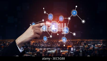 A hand points to a digital network interface, showcasing various icons representing communication and technology over a sprawling urban skyline at Stock Photo