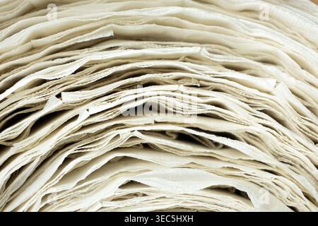 Macro texture of white recycled paper spiral. Stock Photo