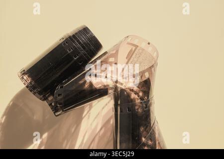 Unrolled 35mm film strips displaying frames with light and shadow Stock Photo