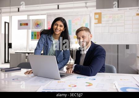 Portrait of two professional colleagues working together in modern office Stock Photo