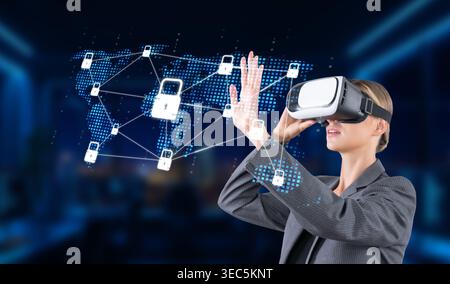 A businesswoman immersed in virtual reality, interacting with cyber security concepts, highlighting the intersection of technology and global security Stock Photo