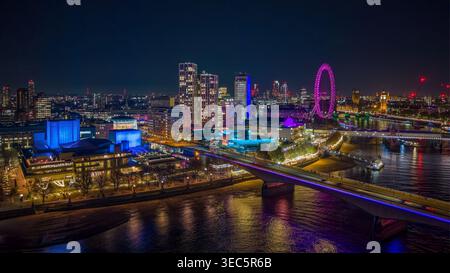 Aerial view of the London skyline at night, featuring illuminated ...
