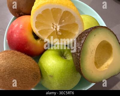 fresh fruits in bowl on grey background banner concept of healthy food, grocery, nutrition Stock Photo