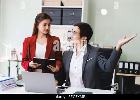 Group of business people and software developers working as a team in office Stock Photo