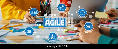 Dynamic workspace showcasing collaborative agile practices with vibrant stationery and visual charts focused on scrum and kanban methodologies for eff Stock Photo