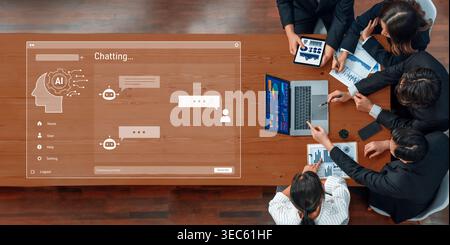 A diverse team of professionals engages in discussion while using a digital chat interface, displaying data analysis and innovative strategies in a Stock Photo