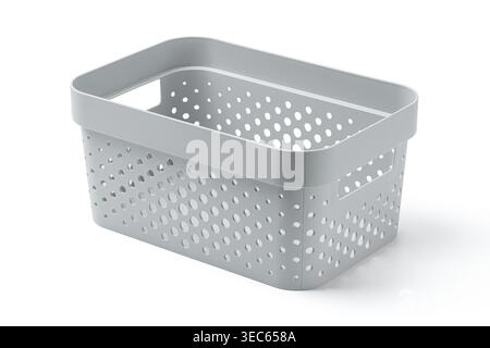 Stack of grey plastic storage baskets with hole pattern on white background. Minimalist home organization and decluttering concept. Studio shot of lau Stock Photo
