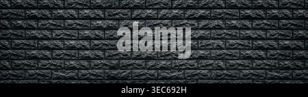 Wide dark gray stone blocks masonry background. Panoramic black brick wall texture Stock Photo