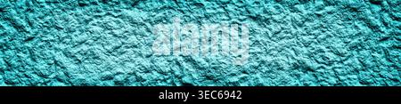 Turquoise stone wall wide texture. Spacious rough teal blue surface. Roomy panoramic background Stock Photo