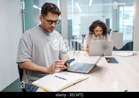 Professional Environment With Colleagues. Collaborative Workspace Showing Focused Team Members Stock Photo