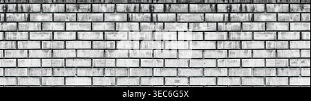 Wide old white shabby brick wall texture. Light gray aged masonry panorama. Whitewashed brickwork panoramic grunge background Stock Photo