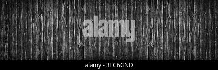 Wide old black knotty wood texture. Dark plank rough surface panorama. Wooden board panoramic background Stock Photo