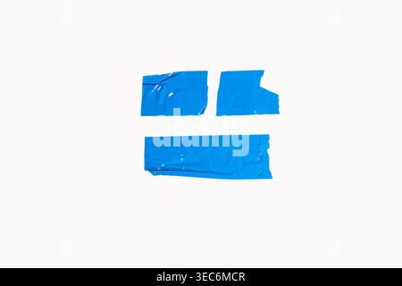 Blue adhesive tape pieces presenting textured, torn edges and sticky surfaces, creating a background element, white background Stock Photo