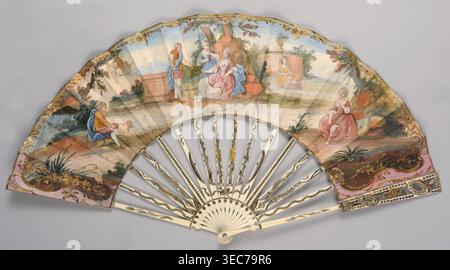 Fan, painted from carved ivory. Feathers decorated with gold and silver metal foil and sequins. Cover feathers with openwork decoration featuring a motif of ovals, shells, and floral sprigs. Right side of the cover painted in gouache with a pastoral scene in a park landscape in whitened colors; dominant colors blue sky/background and pink architectural elements and figures' clothing. Left side of the cover shows a landscape with mountains in the background. Scenes framed by a delicate gold-painted Rococo ornament. 2nd half of the 19th century; possibly 18th century; France, Europe. Pastoral Stock Photo