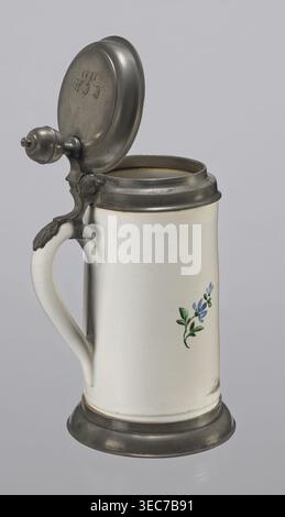 Tin-mounted tankard, Prószków Śląski faience factory 1763–1853. White cylindrical tankard in a pewter mount. On the front: an obese musician playing a double bass in vigorous movement, wearing a yellow jacket, purple pantaloons, and a lilac hat with a yellow brim. Floral sprigs on the sides. On the tin cover engraved CGH/1811. Late 18th century. Province of Silesia 1742–1918, Prószków Śląski. Vessel. Height 24.0 cm, width 15.0 cm, depth 9.5 cm., A tall ceramic stein with a hinged metal lid and base sits against a neutral background; the stein is primarily off-white with a smooth surface, a Stock Photo