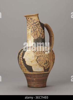 Red-figure oinochoe by the Pennsylvania Torcop Painter, Classified Gallo-Classic Scenography; red-figure pottery, wine vessel depicting mythological scenes and women; 2nd half of the 4th–3rd century BC ca. 300–280 BC, to be verified; Etruria place of origin; vessel; height 31.5 cm, width 16.2 cm, depth 15.6 cm, weight 0.94 kg., A painted ceramic jug with a rounded body, narrow neck, and single curved handle, shown against a plain gray background; the jug has an overall beige and tan base color with areas of black and dark brown paint, white painted dots and pale cream painted regions, and Stock Photo