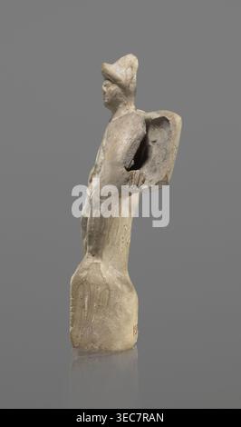 Terracotta gladiator figurine, unknown Southern Italian workshop, terracotta, male figurines. Figure of a gladiator ready for battle on a high base. Legs wide apart, left leg bent, right leg straight. On the calves are greaves reaching above the knees. In his right, bent hand he holds a dagger, and in the other a four-sided shield. He is dressed in a short draped tunic and wears a helmet. The Latin inscription PACILI is visible on the reverse of the base. Preservation condition: part of the base filled with plaster, partial shield and back of the head broken off, reflections, cracks. Date: 2nd Stock Photo