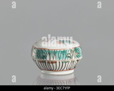 Box with a lid, Chinese, colored porcelain with figural scenes, 19th century, China, vessel, height 4.6 cm, width 6.9 cm, A small round ceramic box with a domed lid sits on a reflective surface against a plain gray background; the box is primarily white with painted decorations including a band of teal green foliage around the upper side, thin brownish-orange outlines, and dark brown linear patterns on the lower section, while the top shows touches of teal green and muted pink on a white field. Stock Photo