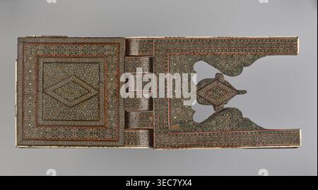 Quran lectern rahla, Islamic art, Persian art, Qajar dynasty 1785–1925, geometric ornament, stands, rahla, Quran, Persian culture, 19th century, Iran, piece of furniture; unfolded: length 21.5 cm, width 41.4 cm; folded: length 41.5 cm, width 16.5 cm., A rectangular carved object with intricate repeating geometric inlay patterns covering most surfaces, showing a central diamond motif framed by concentric decorative borders on the left panel and a matching patterned right panel with a cutout section and a raised diamond element; the design uses a palette of brown, dark green, black, cream, gold, Stock Photo