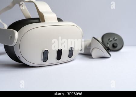 Modern virtual reality headset with controllers on clean white background, immersive technology concept for gaming, simulation and digital experience. Stock Photo