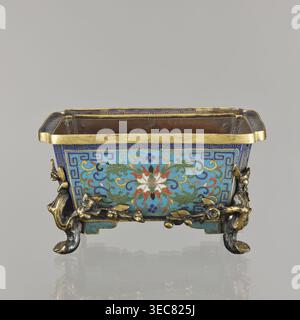 Flower pot;, Chinese, Qing dynasty 1644–1911. Cloisonné enamel incense burner on four legs; decoration of lotuses and lotus tendrils on a turquoise background, legs in the shape of flowered trunks plum branches in gilded bronze; ornament motifs include plum trees, cracked ice, and meander. 18th century. Vessel jardiniere/incense burner. Height 9.5 cm; width 17.2 cm; depth 12.0 cm., A rectangular decorative container with a gold rim sits on a reflective surface, showing a front panel decorated in bright blue and turquoise enamel with a complex floral and scroll pattern in green, red, white, and Stock Photo