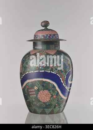 Vase with cover, ca. 1860–1870 late Edo–early Meiji, Japan, Nagoya. Cloisonné enamel vessel with cover, height 55.5 cm, diameter 35.0 cm. Decorated in cloisonné with geometric-floral patterns including shippo, asanoha, kikko, floral ornament, and dragons Japanese dragon motif., A lidded vase with a rounded body and a domed lid topped by a knob, decorated overall with dense small-scale patterns and floral motifs in a palette that includes green, blue, pink, red, white, and gold; a broad sinuous band of deep blue edged with pale pink winds around the body, set against a richly patterned green Stock Photo