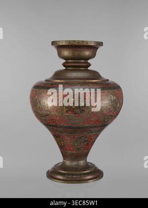 Vase, gift; Indian, 19th century. Vase with a bulging, flattened belly tapering toward the bottom; wide spout and round foot. Polychrome in red, pink, yellow, white and black. Subject motifs: gods Vishnu, Shiva, teachers, fish, plant ornaments, geometric ornaments, ascetics; functions: jug/container. Vessel; height 50.0 cm, diameter 13.0 cm, weight 5.75 kg., A rounded ornamental vessel with a flared rim and pedestal base, decorated with intricate painted scenes and floral motifs; the surface shows a metallic bronze tone with prominent red accents and touches of gold, along with darker brown Stock Photo