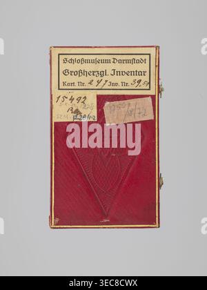 Key case, Rectangular key case with a hinged lid and two clasp hooks. Trimmed with red leather, with gilded embossing; on the lid, a frame along the edge with an ornament in the corners. In the centre, a ducal mitre. On the underside, a gilded frame along the edge, in the centre a non-gilded embossed rhombus with an inscribed quatrefoil, and in the centre a rhombus with a four-petal rosette. Inside, typewritten note describing presentation in 1833 to Grand Duchess Mathilde. 1833, Germany; Darmstadt. Varia. Height 9.8 cm, width 5.9 cm, depth 1.8 cm., A rectangular object with a deep red cover Stock Photo