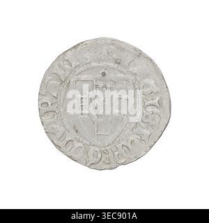 Teutonic szeląg, Herman Gans (1413–1414). Obverse: Monastic shield of the Grand Master; dot above the shield; in the rim between the pearl borders, inscription. Reverse: Monastic shield; above the shield the letter D; in the rim between the pearl borders an inscription. Date 1413–1414. Teutonic Knights (order). Gdańsk mint. Coin; diameter 21.4 mm; weight 1.53 g; axis 225°., A round, worn coin with a raised central shield-like design and decorative border, showing textured and pitted surfaces; the coin appears mostly light gray with areas of slightly darker gray and small brownish spots, and Stock Photo