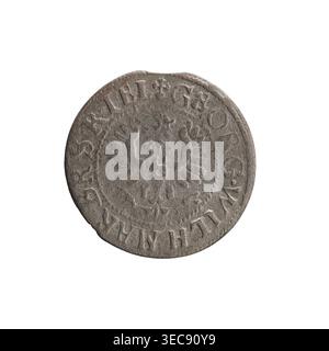 Szeląg (coin), Ernest Pfahler. Obverse: Prussian eagle, on its chest the crowned letter S; in the rim between borders an inscription beginning with a heart: GEORG.WILH.MAR.BR.SRIEL. Reverse: monogram composed of the letters GW; in the rim between borders an inscription beginning with a rosette, divided by the Hohenzollern coat of arms: SOLID,-VSSIAE. Date: 1629. Mint: Königsberg, Ducal Prussia (1525–1701). Diameter 16.5 mm; weight 0.55 g; axis 0°., A circular, worn coin with an uneven edge, shown against a white background; the coin surface is mostly gray with darker gray patina and lighter Stock Photo