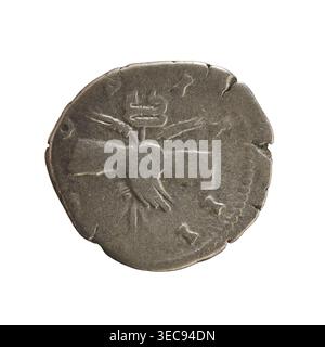 Denarius, Antoninus Pius (86–161; Roman Emperor 138–161). Obverse: Emperor's head right in a laurel wreath with inscription 'ANTONINVS AVG PIVS PP'. Reverse: Hands clasped on a caduceus and two ears of corn with inscription 'C O S I I I I'. Roman Empire, 145–161. Silver coin, weight 3.31 g, axis 135°., A round, worn coin with an uneven edge shown against a white background, displaying a central raised design that includes a heart-shaped form and a horizontal bar with a vertical element above it; the surface shows scratches, small dents, and irregularities. The coin appears in shades of gray Stock Photo