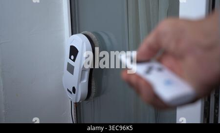 A High-Tech Window Cleaning Robot Controlled by Remote: Experience the Ease of Automated Cleaning Solutions for Your Home and Office Windows Stock Photo