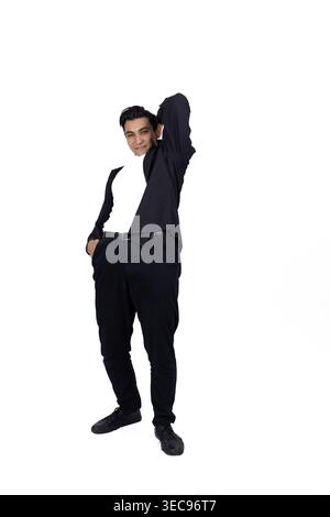Confident young man in a black turtleneck posing Stock Photo
