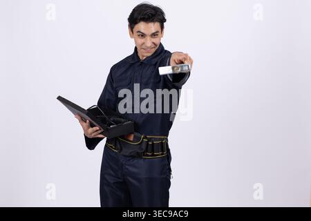 Professional security guard showing identification card in studio Stock Photo