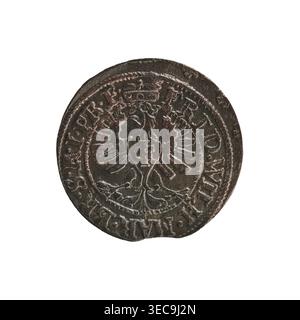 szeląg; Frederick William I Hohenzollern (Great Elector of Brandenburg; Prince of Prussia; 1620–1688); 1653; Ducal Prussia (1525–1701), Königsberg; coin (szeląg), diameter 15.6 mm, weight 0.59 g, axis 0°., A round metallic object with a worn, textured surface showing a raised central design resembling a double-headed bird or eagle with outstretched stylized wings, surrounded by a circular border and decorative raised rim; the metal appears dark brown with areas of lighter brown and subtle greenish patina, and the edge shows irregularities and small dents. Stock Photo