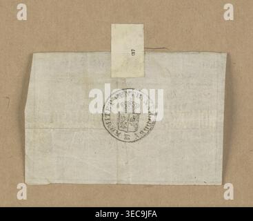 Nominal receipt No. 33170 issued in the name of Hube for the amount of 1,400 złoty on June 15, 1863. On the reverse, a round seal of the Central National Committee with a two-part shield under a crown. 1863, Kingdom of Poland (1815–1918). Security/receipt; dimensions 1.96 mm × 2.64 mm., A folded pale off-white paper sheet with visible creases lies centered on a textured brown background; the sheet shows a circular dark gray stamped emblem near its center with a small intricate shield and crown inside, and a narrow rectangular pale paper tab is attached near the top edge of the sheet, extending Stock Photo