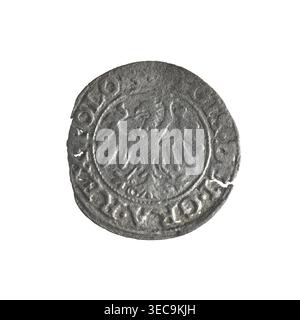 Gdańsk szeląg, Sigismund I the Old (King of Poland; 1506–1548); Obverse: Eagle of Royal Prussia with inscription in rim between pearls: GIS.DEI.GRA.REX.POLO; Reverse: Coat of arms of Gdańsk with inscription in rim between pearls: MON.IVI.GEDANEN.1546; 1546; features emblems and coats of arms of cities, Jagiellon dynasty eagles; Polish coin; Gdańsk., A round, worn metallic object with a textured surface appears against a white background; it shows a raised central motif resembling a stylized bird with outstretched wings encircled by a raised border, and the outer edge features a repeating Stock Photo