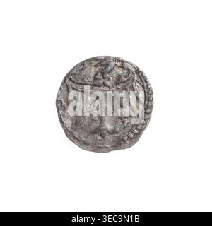 Heller, Frederick II (Duke of Brzeg-Legnica; 1480–1547), George I (Duke of Brzeg-Legnica; ca. 1481–1521); obverse: checkerboard — coat of arms of the Duchy of Brzeg; reverse: in the pearl border the Silesian eagle; iconography: eagles, Silesian eagle, chessboards; date: 1495–1505; region: Silesia, Duchy of Brzeg-Legnica-Wołów, Legnica; coin; diameter 12.3 mm; weight 0.31 g., A worn round metallic object with a rough textured surface appears centered against a white background, showing shades of gray and darker gray with subtle brownish and bluish patina; its edge has a beaded border on one Stock Photo