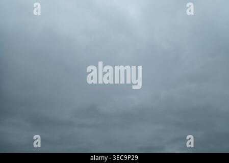 Dark grey storm clouds gathering in the sky Stock Photo