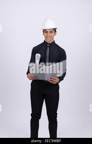 Engineer in hard hat holding digital tablet Stock Photo