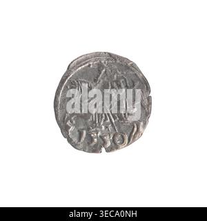 Lithuanian denarius, Sigismund II Augustus (King of Poland; 1544–1572); emblems of the Jagiellon dynasty; Polish coins; motifs: eagle (obverse, in the rim) and Pursuer (emblem of Lithuania; reverse, in the rim); date below the reverse: 1556; Grand Duchy of Lithuania, Vilnius; coin; diameter 12.2–12.8 mm; weight 0.27 g, A round metallic object with an irregular worn edge sits centered on a white background; the object has a dull silver-gray color with areas of darker gray and subtle brownish tones, and shows a raised design with worn, embossed shapes including curved lines and abstract forms Stock Photo