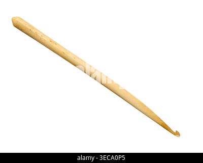 Bone crochet hook with smooth tapered shaft isolated on white background. Handcraft tool used for knitting, crocheting, and yarn work projects. Stock Photo