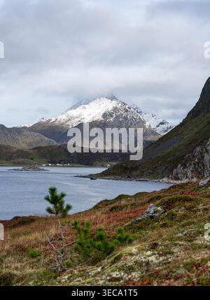 Snow-covered mountain view from Offersoykammen hike in Lofoten, Norway Stock Photo
