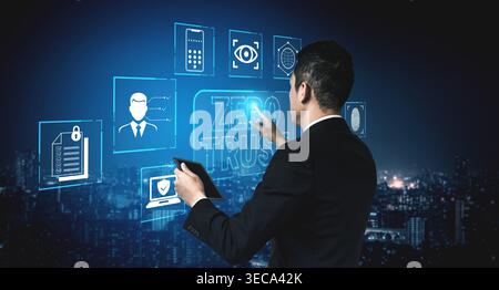 Businessman Interacting with Zero Trust Security Concept Digital Interface in Modern City at Night Fluxor. Stock Photo