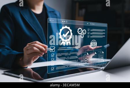 ISO certification and compliance audit management concept. Businesswoman reviewing checklists, approval documents, and quality verification, represent Stock Photo